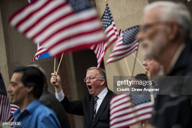 Supporters of Joe Concannon, a retired NYPD captain and current candidate for NYC City Council District 23, cheer during a 'Support Your Police'...