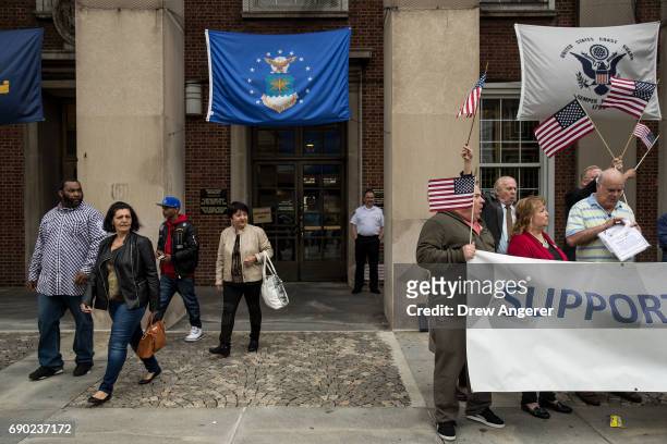 Group exits the building as supporters of Joe Concannon, a retired NYPD captain and current candidate for NYC City Council District 23, cheer during...