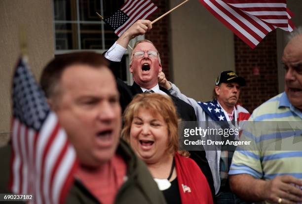 Supporters of Joe Concannon, a retired NYPD captain and current candidate for NYC City Council District 23, cheer during a 'Support Your Police'...