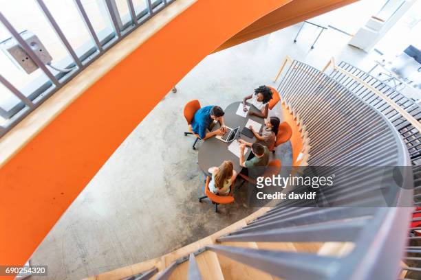 top down view of open plan business meeting - overhead view office stock pictures, royalty-free photos & images