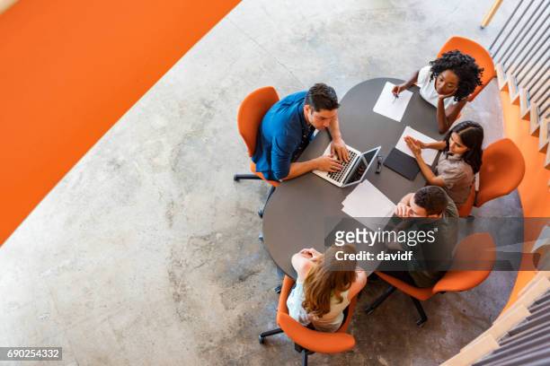top down view of open plan business meeting - overhead view stock pictures, royalty-free photos & images