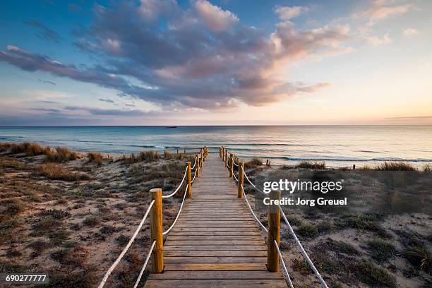 mediterranean sea at son bou, minorca (sunset) - minorca stock pictures, royalty-free photos & images