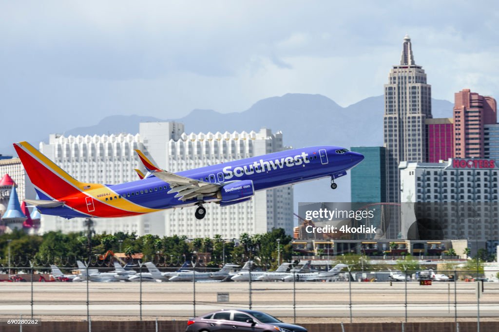 Las Vegas Hotel Casino Buildings with airplane taking off in the foreground