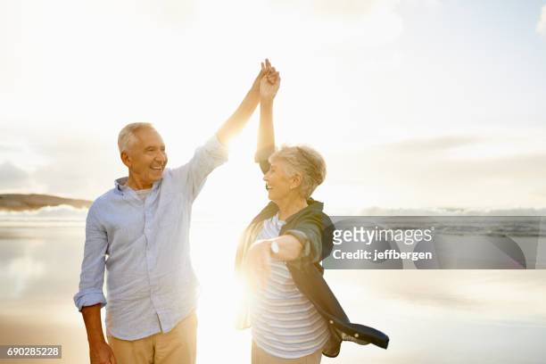 love makes the good times even better - senior women dancing stock pictures, royalty-free photos & images