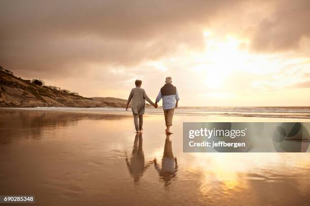 where there is lasting love there is life - beach walking stock pictures, royalty-free photos & images