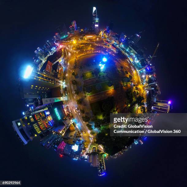 360° aerial night view of saigon's downtown - hdri 360 stock-fotos und bilder