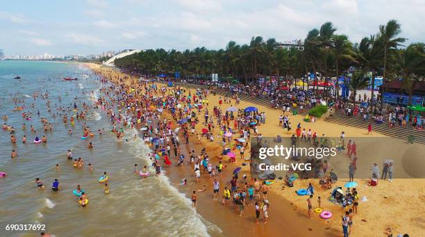 Aerial view of crowd at beach on May 30, 2017 in Haikou, Hainan Province of China. Thousands of people came to the beach in Haikou on the Dragon Boat...