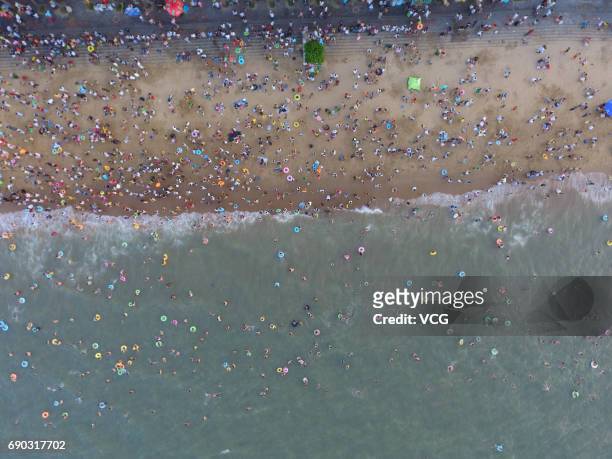 Aerial view of crowd at beach on May 30, 2017 in Haikou, Hainan Province of China. Thousands of people came to the beach in Haikou on the Dragon Boat...