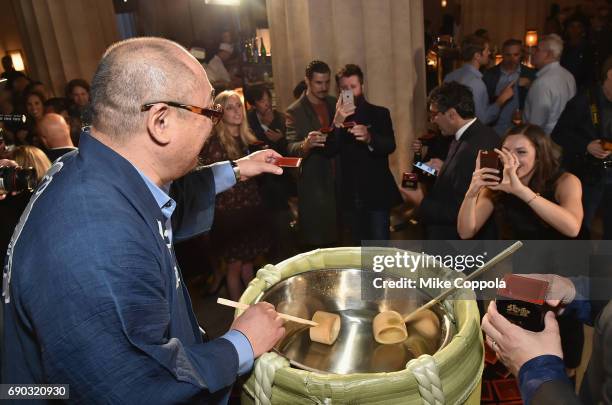 Hazu Fumio of Hokusetsu Sake and Nobu Restaurants East Coast Head of Operations Leong Loh serve guests during the Nobu Downtown Sake Ceremony at Nobu...