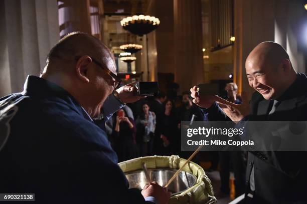 Hazu Fumio of Hokusetsu Sake and Nobu Restaurants East Coast Head of Operations Leong Loh serve guests during the Nobu Downtown Sake Ceremony at Nobu...