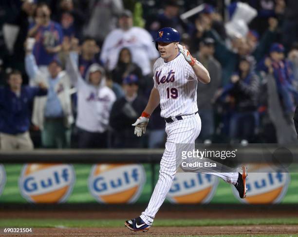 Jay Bruce of the New York Mets celebrates after he drives in the game winning run in the 12th inning against the Milwaukee Brewers on May 30, 2017 at...