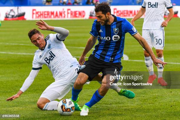 Hard fight by Montreal Impact midfielder Ignacio Piatti to keep control of the ball while chased by Vancouver Whitecaps defender Jake Nerwinski...