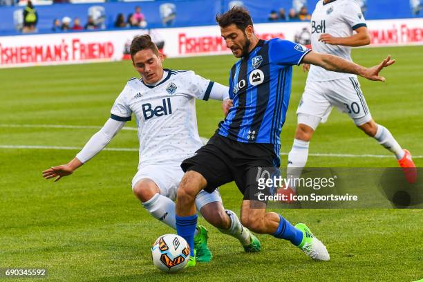 Hard fight by Montreal Impact midfielder Ignacio Piatti to keep control of the ball while chased by Vancouver Whitecaps defender Jake Nerwinski...