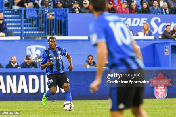 Montreal Impact midfielder Patrice Bernier in control of the ball with Montreal Impact midfielder Ignacio Piatti in the foreground during the...