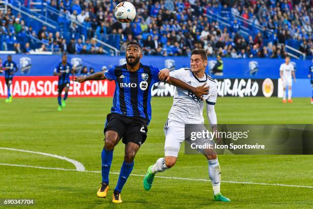 Montreal Impact forward Anthony Jackson-Hamel and Vancouver Whitecaps defender Jake Nerwinski fighting to control the ball during the Montreal Impact...