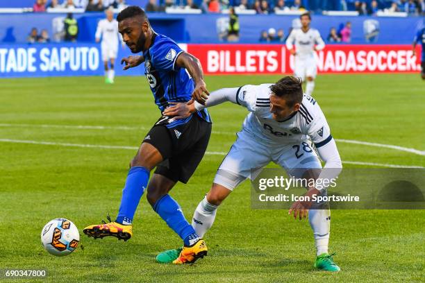 Montreal Impact forward Anthony Jackson-Hamel and Vancouver Whitecaps defender Jake Nerwinski fighting to control the ball during the Montreal Impact...