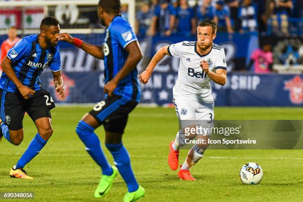 Vancouver Whitecaps midfielder Ben McKendry running and looking away while in control of the ball during the Montreal Impact versus the Vancouver...