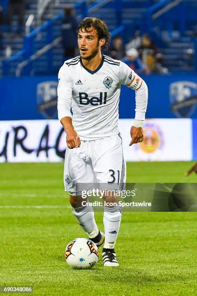 Vancouver Whitecaps midfielder Russell Teibert pointing in front of him on the field while controlling the ball during the Montreal Impact versus the...