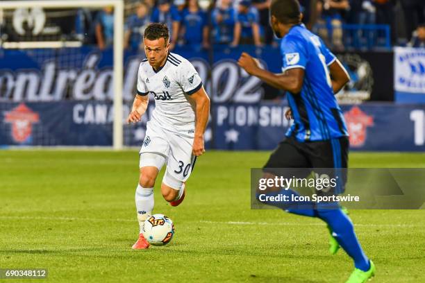 Vancouver Whitecaps midfielder Ben McKendry running and looking away while in control of the ball during the Montreal Impact versus the Vancouver...