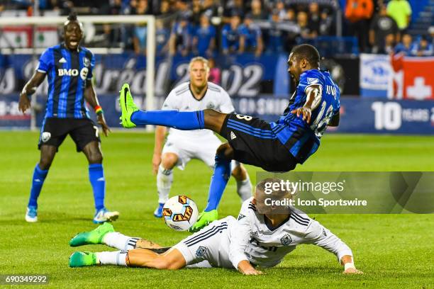 Montreal Impact defender Chris Duvall flipping in the air after a collision with Vancouver Whitecaps midfielder Brek Shea during the Montreal Impact...