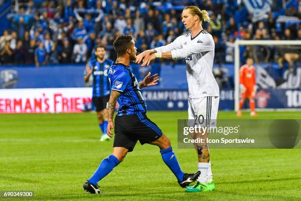 Vancouver Whitecaps midfielder Brek Shea pushing Montreal Impact midfielder Adrian Arregui while arguing with each other during the Montreal Impact...