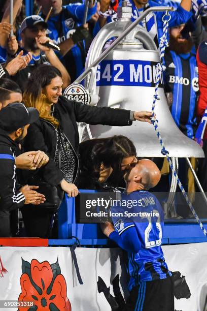 Montreal Impact defender Laurent Ciman jumping in the crowd after the win to kiss his wife in the stands during the Montreal Impact versus the...