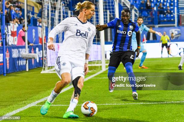 Montreal Impact defender Ambroise Oyongo going after Vancouver Whitecaps midfielder Brek Shea during the Montreal Impact versus the Vancouver...