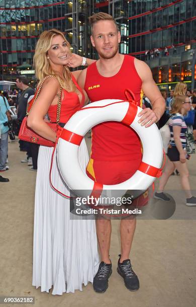 Annika Gassner with a life guard during the Baywatch European Premiere Party on May 31, 2017 in Berlin, Germany.