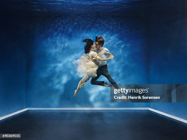 a couple dancing under water - passion bildbanksfoton och bilder