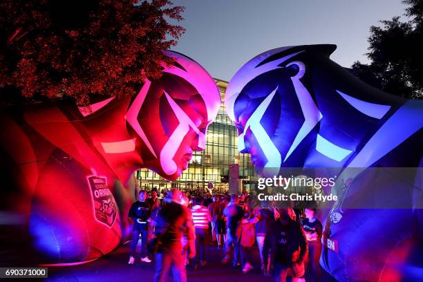 Crowds arrive through a Blues and Maroons mascot outside Suncorp before the State Of Origin series between the Queensland Maroons and the New South...