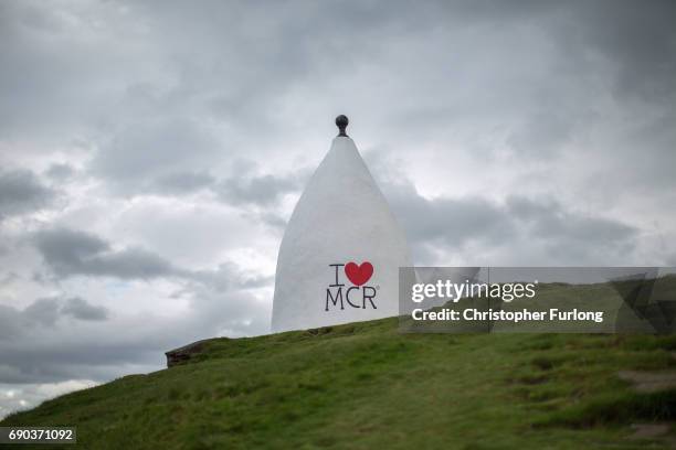 The 'I love Manchester' symbol adorns the side of Bollington White Nancy to remember those killed and injured in the Manchester Arena attack, on May...