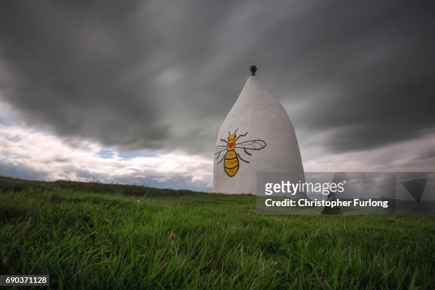 Worker bee adorns the side of Bollington White Nancy to remember those killed and injured in the Manchester Arena attack, on May 30, 2017 in...