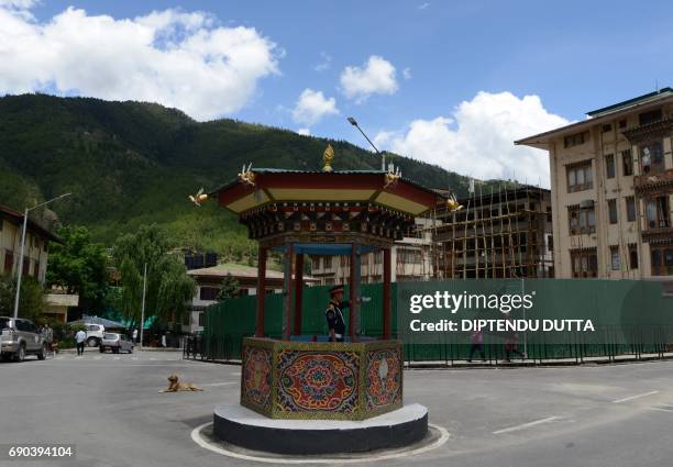 Bhutanese traffic guard directs vehicles at a junction in Thimpu on May 31, 2017. Japanese Princess Mako is scheduled to arrive on a nine-day...