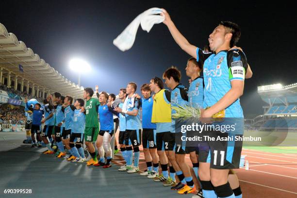 Kawasaki Frontale players celebrate their 4-1 victory after the AFC Champions League Round of 16 match between Kawasaki Frontale and Muangthong...