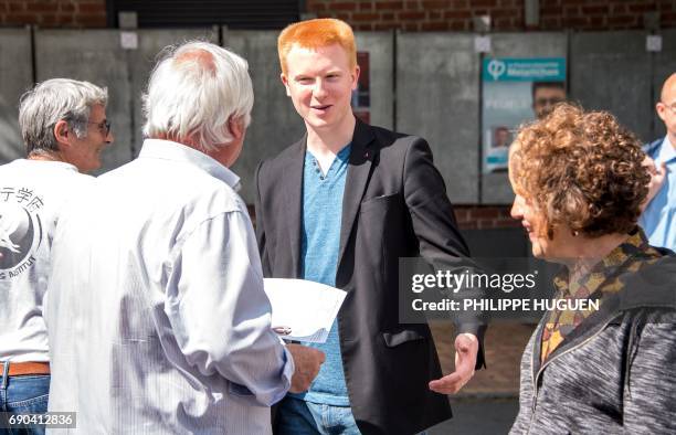 Candidate for the far-left France Insoumise party for upcoming legislative elections in the 1st constituency of Lille, Adrien Quatennens distributes...