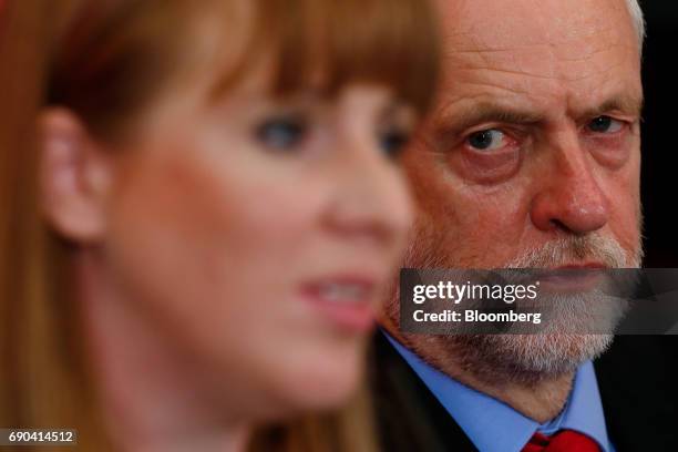Jeremy Corbyn, leader of the U.K. Opposition Labour Party, right, listens as Angela Rayner, Labour Party spokesperson for education, speaks during a...
