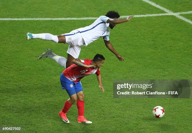 Josh Onomah of England leaps over Randall Leal of Costa Rica during the FIFA U-20 World Cup Korea Republic 2017 Round of 16 match between England and...