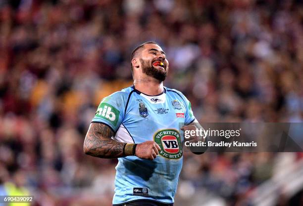 Andrew Fifita of the Blues smiles at the crowd after scoring a try during game one of the State Of Origin series between the Queensland Maroons and...