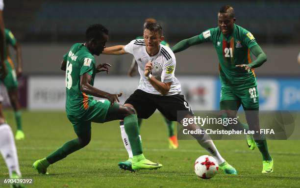 Fabian Reese of Germany battles with Shemmy Mayembe of Zambia and Boyd Musonda of Zambia during the FIFA U-20 World Cup Korea Republic 2017 Round of...