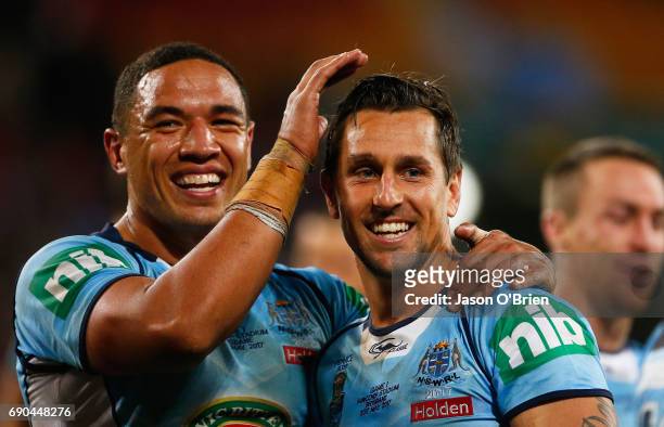 Mitchell Pearce and Tyson Frizell of the Blues celebrate during game one of the State Of Origin series between the Queensland Maroons and the New...