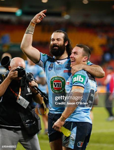 Aaron Woods and James Maloney of the blues celebrate during game one of the State Of Origin series between the Queensland Maroons and the New South...