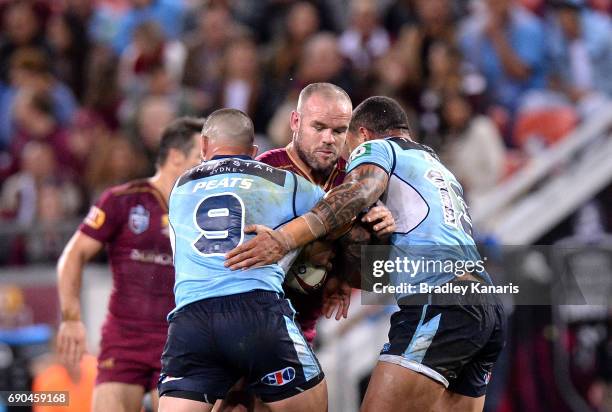 Nate Myles of the Maroons takes on the defence during game one of the State Of Origin series between the Queensland Maroons and the New South Wales...