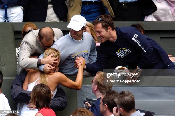 Maria Sharapova of Russia embraces her father after winning the ladies singles final match against Serena Williams of the United States during the...