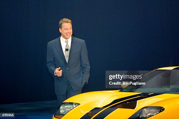 William Clay Ford Jr., Chairman and CEO of Ford Motor Company stands next to the new Ford GT40 concept car at the 2002 North American International...