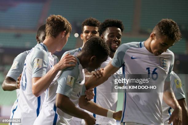 England's forward Ademola Lookman celebrates his goal with teammates during their U-20 World Cup round of 16 football match between England and Costa...