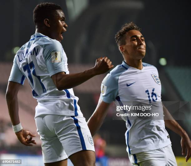 England's forward Ademola Lookman celebrates beside teammate Dominic Calvert-Lewin after scoring during their U-20 World Cup round of 16 football...