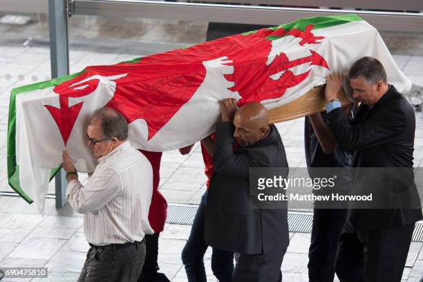 The coffin is carried in during the funeral of former First Minister of Wales Rhodri Morgan at the Senedd in Cardiff Bay on May 31, 2017 in Cardiff,...