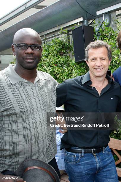 Football Player Lilian Thuram and Sports director of the "Racing Club de Toulon Rugby", Fabien Galthie attend the 2017 French Tennis Open - Day Four...