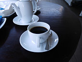 Hot black coffee in white cup
