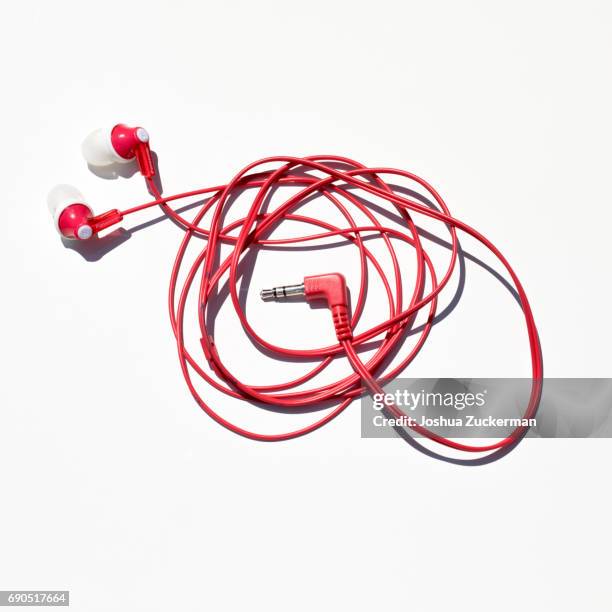 headphones photographed against a white background. - tangled fotografías e imágenes de stock